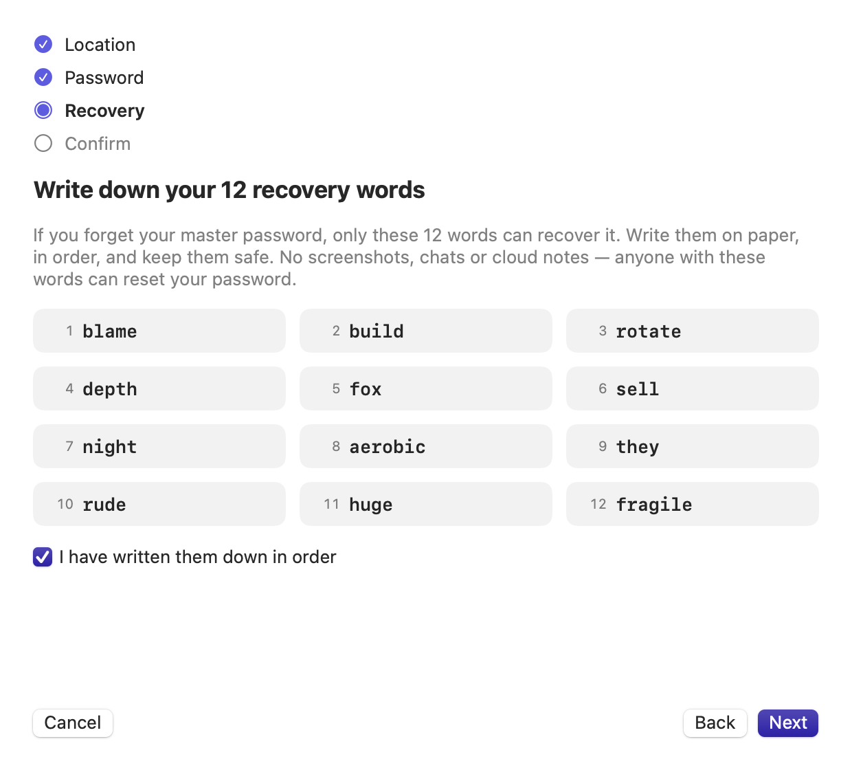 The FolderSafe setup step that shows 12 numbered recovery words to write down.